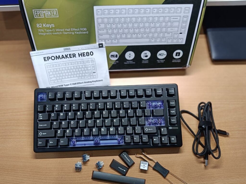on a desk every item place to show what's a user can get in the Epomaker HE80 Hall Effect Keyboard